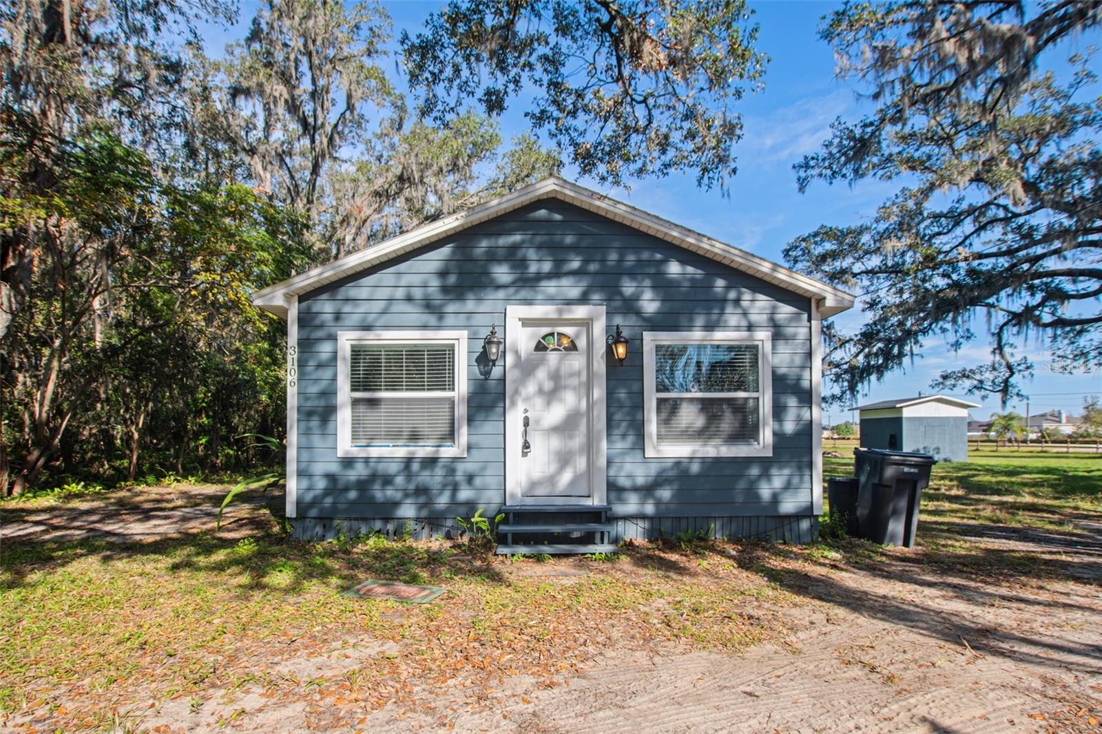 One or more photo(s) has been virtually staged. Make this charming 4-bedroom, 1-bathroom house your new home nestled on a spacious 1-acre lot in Plant City! The inviting living room provides ample space to relax or create a cozy home office, while the back patio is ideal for unwinding outdoors. The bright and airy kitchen boasts stainless steel appliances, granite-like countertops, a central island, wood cabinets, and a seamless flow into the dining area—perfect for hosting gatherings. Outside, the fully fenced backyard offers privacy and plenty of space for outdoor activities, with a large gate providing easy vehicle access. Conveniently located near schools, shopping, dining, and major highways, this home ensures quick access to Tampa, Lakeland, and Orlando. Don’t miss the opportunity to make this versatile and inviting property your own!