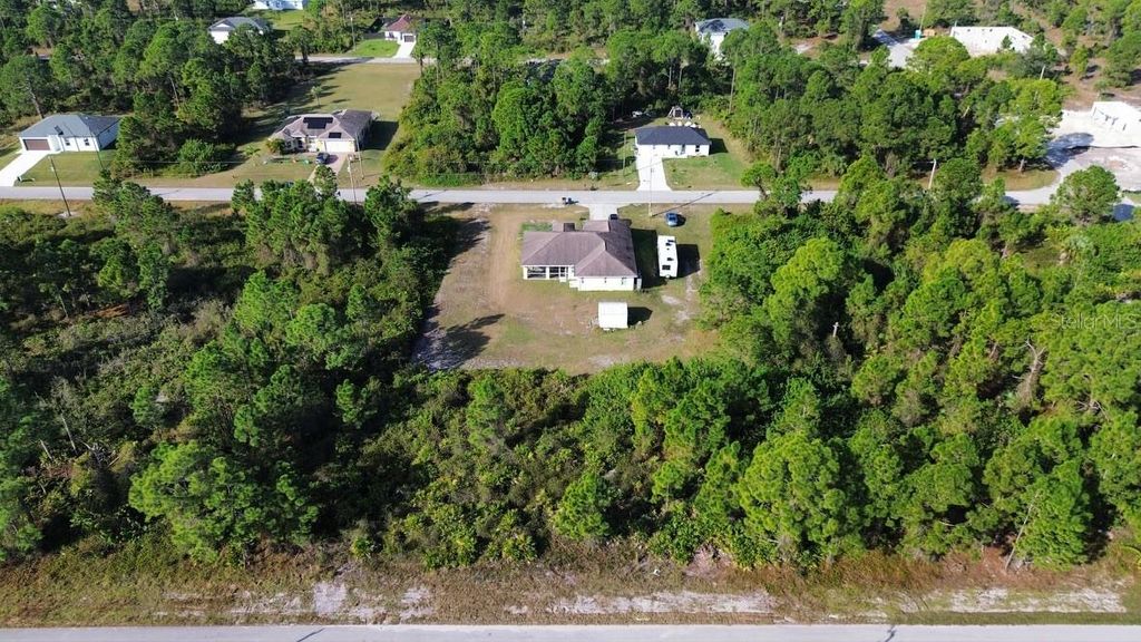 Photo of 710 Randall Avenue E, Lehigh Acres, FL 33974 (MLS # O6393757)