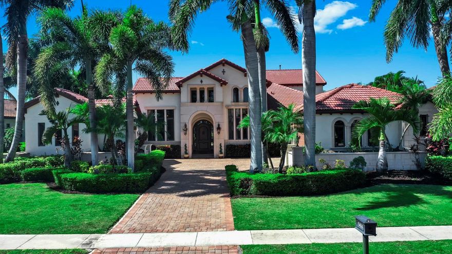 WATERFRONT LUXURY ESTATE! PRIVATE DOCK, POOL/ SPA with STUNNING WATERVIEWS! Live the waterfront dream in this stunning estate home located in an exclusive gated neighborhood. Offering over 5,000 sq ft of luxury living, this 5-bedroom, 6-bath masterpiece blends sophisticated design with resort-style amenities — complete with a private dock and 16,000 lb boat lift. Step into elegance with travertine and luxury vinyl flooring throughout, paired with soaring double tray lighted ceilings, expansive windows and sliders, and a grand wood front door that sets the tone for what lies within. The custom chef’s kitchen is a showstopper, featuring high-end appliances, stone countertops, a disappearing walk-in pantry, and a spacious layout designed for both everyday living and entertaining. Retreat to the luxurious master suite, overlooking the water and pool, complete with a spa-inspired bathroom, dual walk-in custom closets, and serene privacy. Each bedroom in the home has direct access to its own private bath, ensuring comfort and convenience for all. Entertain in style with a game room/bar on the main floor—offering a wet bar, wine fridge, ice maker, and gorgeous water views. Upstairs, you'll find a complete secondary living area, including a bonus room, full bath, private bedroom, and a sprawling balcony overlooking the water — ideal for guests or multigenerational living. The backyard is a private resort, showcasing a sparkling pool and spa, multiple water features, an outdoor kitchen, pool bath, and a covered patio with an outdoor fireplace. Inside, enjoy the ambiance of a double-sided fireplace that warms both formal and casual spaces. Additional highlights: 4-car garage, NEW TILE ROOF 2025, Separate office, Oversized laundry room, Custom finishes and upgrades throughout. This estate is more than a home — it’s a lifestyle. Waterfront living paired with unparalleled luxury all come together in this one-of-a-kind property.