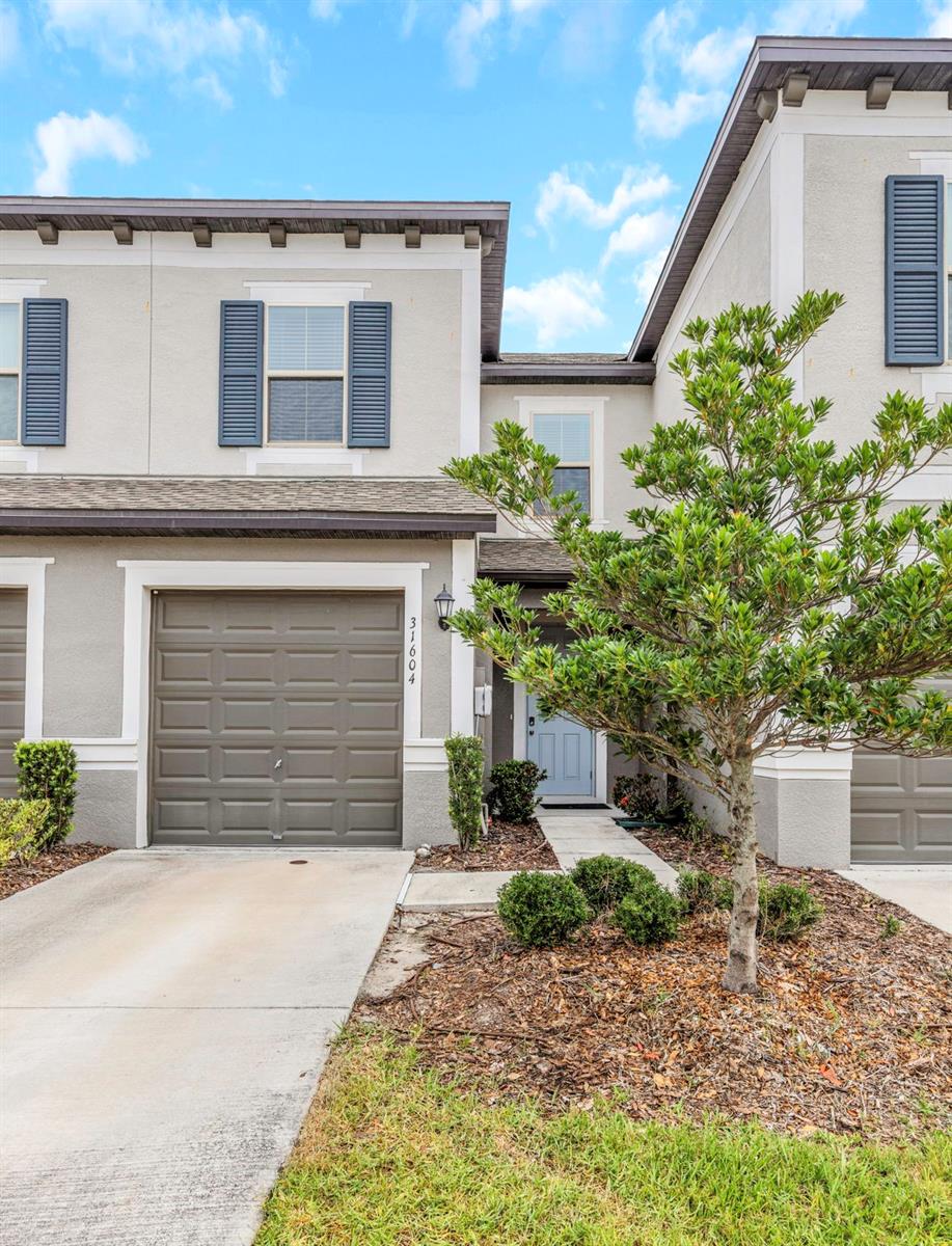 Photo of 31604 Blue Passing Loop, Wesley Chapel, FL 33545 (MLS # O6415896)
