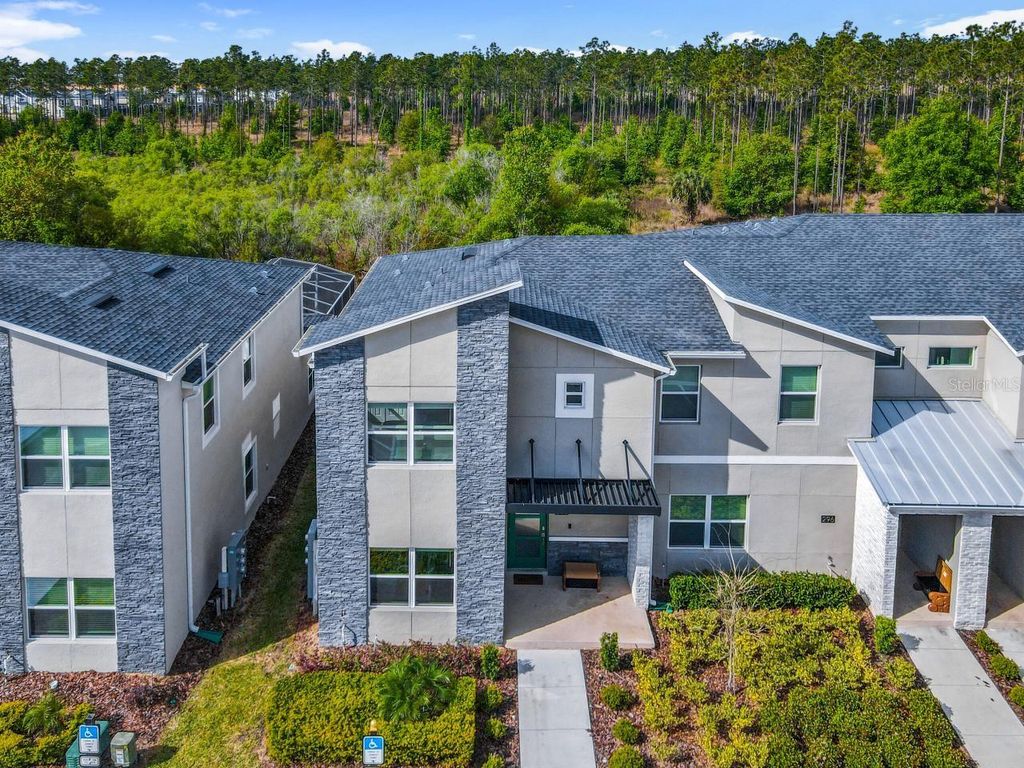 Photo of 302 Ocean Course Avenue, Davenport, FL 33896 (MLS # O6344021)