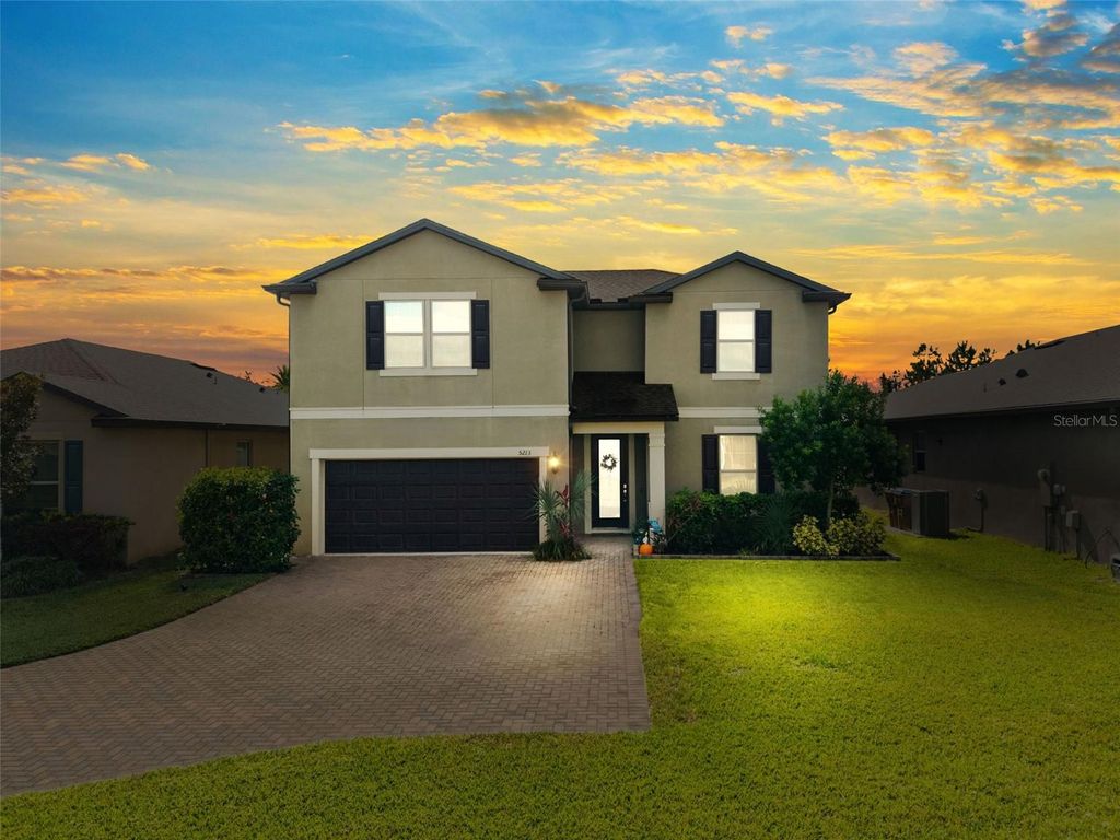 Photo of 5213 Brydon Woods Circle, Magnolia Square, FL 34771 (MLS # O6359225)