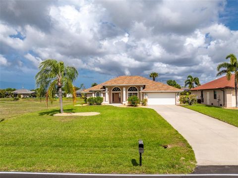 Photo of 1054 Boundary Boulevard, Rotonda West, FL 33947 (MLS # D6146896)