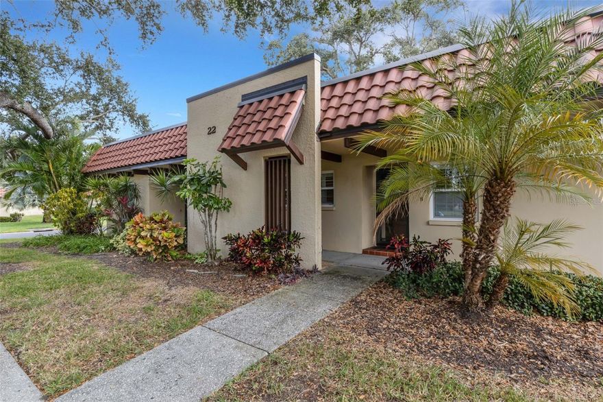 Discover carefree Florida living in the heart of Pinehurst Village — where this charming villa-style home (2 bedrooms, 1 bath, approx. 875 sq ft) blends comfort, style and convenience. Fresh interior paint and tiled floors with newly-sealed grout create a crisp and inviting interior. The kitchen boasts granite countertops and stainless steel appliances, while the spa-style bath features a premium Kohler walk-in tub for comfort and safety. Updates such as a new water heater, updated electrical panel, newer AC and windows mean peace of mind is built in. Located in a vibrant 55+ community with beautifully-kept grounds, clubhouse, pool, shuffleboard and grilling areas, you’ll enjoy a true maintenance-free lifestyle (HOA covers building exterior, lawn care, water/sewer, cable/internet). Just minutes from downtown Dunedin’s shops and restaurants, the Pinellas Trail, marina and Gulf-coast beaches, this villa offers the ideal blend of convenience and coastal charm. Whether you’re looking for a full-time residence or a season sanctuary, Unit 22B is ready to welcome you home. This unit is NOT IN A FLOOD ZONE!!