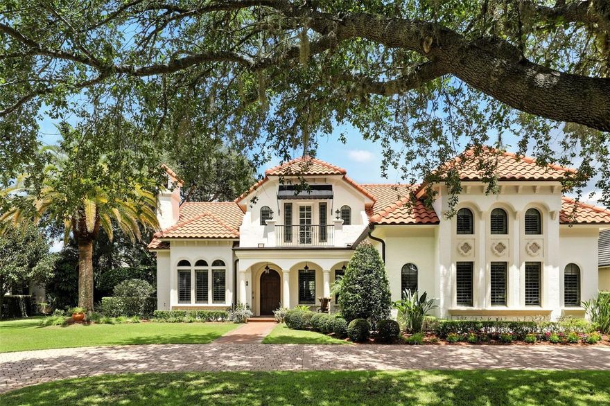 Experience Mediterranean charm in this fabulous five-bedroom, five-bath pool home built by Cahill Builders. On the north side of Windsong, this home features an open floor plan with spacious living areas that flow seamlessly and provide warm natural light.  The living room with cozy gas fireplace overlooks the spacious and open dining room while the light-filled family room with French doors has wonderful views of the covered lanai and pool.  You will love entertaining in the chef’s eat-in kitchen with many updates and upgrades completed in 2024. Kitchen features include stainless appliances, natural gas cooktop, double ovens, large center prep island and large walk-in pantry. The first-floor luxurious owner’s retreat features vaulted and hand-crafted wood beam ceilings, wide plank wood floors and bath with dual vanities, walk-in shower and spa tub. Bedroom Suite 2, which is also on the main level is ideal for guests, home office or nursery.  As you go upstairs, the second floor offers a thoughtfully designed retreat for both relaxation and entertainment.  There are three spacious bedrooms each with their private baths. This layout offers comfort and privacy for family or guests. The media room provides the ideal setting for movie nights or immersive gaming and includes an additional room for a playroom, library or large air-conditioned storage space. Whether you are entertaining or unwinding, this upper-level layout delivers functionality and privacy. Go outside to enjoy the covered lanai which overlooks the private and expansive yard filled with a vibrant mix of citrus trees, tropical plants and year-round flowering garden. The fabulous landscape was designed by a landscape architect with the concept to provide continuous blooms and inviting sitting areas under the sun. The sparkling pool and spa, large surrounding patio and firepit area invite year-round enjoyment. Additional amenities include custom molding and trim work, an entry fountain and three-car garage (one with split air conditioning). Windsong, one of Winter Park's sought-after neighborhoods, offers exclusive amenities to their residents including a pontoon boat to enjoy Winter Park Chain of Lakes, two community pools, a splash park, playground, a lakefront clubhouse and a scenic pier for fishing.  Ideal location is minutes from hospitals, schools, golf courses, and Park Avenue’s amazing dining and shopping.