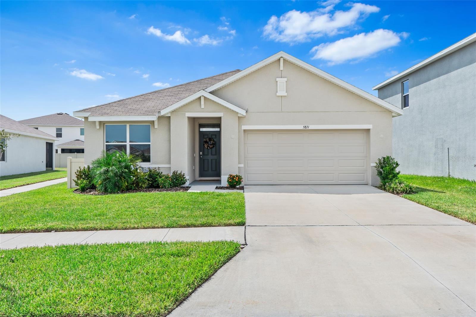 MOVE-IN READY WITH PREMIUM UPGRADES! 3BR/2BA, 1,690 sq ft 2024 DR Horton Aria floor plan on an oversized premium lot in Westgate of Avalon Park West. Only 1 year old with nearly $20K invested in upgrades, including: water softener + reverse osmosis system, Kohler kitchen sink, luxury vinyl plank flooring in all bedrooms, modern ceiling fans throughout home, fully fenced yard, garage overhead racks, attic plywood for seasonal storage & so much more. (Full upgrade list available.) Enjoy peaceful green space right out front—perfect for morning grounding or fetch with Fido. Resort-style amenities include 3 pools, hot tub, splash pads, dog parks, playgrounds, pickleball, sidewalks, and clubhouses. Just minutes to the new Avalon Park West Downtown with shopping, dining, markets, and community events—plus amphitheater & new high school coming soon. Prime Wesley Chapel location near Shops at Wiregrass, The Krates at The Grove, Tampa Premium Outlets, Costco, and a brand-new one of the nation's largest Targets opening Sept 2025. Easy access via SR 54 to I-75/275 for downtown Tampa, airport & Gulf beaches. Top-rated schools and Wesley Chapel’s thriving growth in medical, tech & entrepreneurship make this the perfect Live, Learn, Work, Play lifestyle that Avalon Park West is all about.