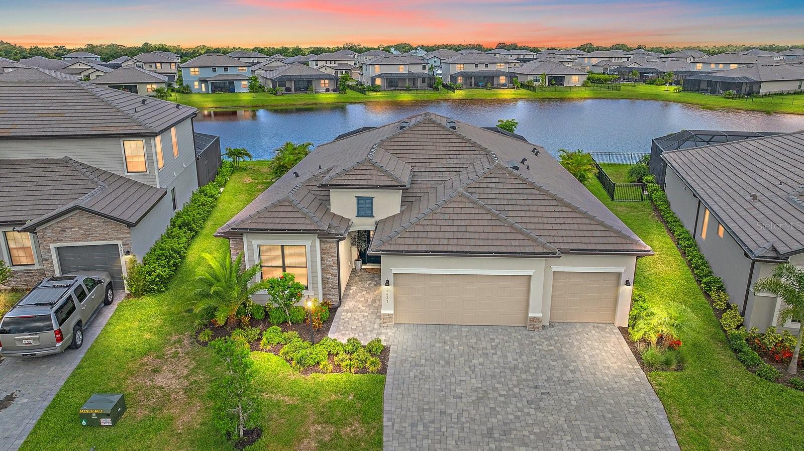 You will be proud to call this GORGEOUS home YOURS! The peaceful views of the lake are AMAZING and it shows like a model home!
Each generously sized bedroom offers a cozy retreat, and the 3-CAR GARAGE provides plenty of room for vehicles and extra storage! This home is FILLED with UPGRADES, including:
**Whole House Paint
**Upgraded Ceramic Tile Flooring
**CULLIGAN Water Softener
**Leveler Automatic Blinds over Patio Doors
**Wainscoting in Dining Room
**Crown Moulding in Living Room and Primary Bedroom
**Decorative Tile on Backsplash and Island
**Upgraded Light Fixtures
**Added Ceiling Fans in 4 Bedrooms, Living Room & Lanai. Next, step outside to your own little paradise! Enjoy a refreshing dip in the beautiful HEATED POOL and SPA with UPGRADED LANDSCAPING to provide LOTS OF PRIVACY!
Don't tell your family and friends up North if you buy this home, because you will never get rid of Company! You will "LIVE ON VACATION in Lorraine Lakes! SO MANY FANTASTIC AMENITIES—* 24/7 gated security for peace of mind *a fully equipped Gym *RESORT STYLE POOLS *a fun splash pad! *Tennis *Pickleball *Volleyball *Basketball, and Bocce ball. Eat lunch or dinner at the Clubhouse or meet friends for drinks at the Clubhouse! Come see why Lorraine Lakes in Lakewood Ranch is the perfect place to call home! Lakewood Ranch is recognized as the #1 Master-Planned Community in the USA! Conveniently located near I-75, TOP "A" RATED schools, world-class dining, shopping, and entertainment, this prime location is just 30 minutes from Sarasota’s world-famous beaches. Don’t miss this rare opportunity to own a meticulously cared-for home in an exceptional community! "This life is not a dress rehearsal, live your best life and LIVE ON VACATION NOW!"