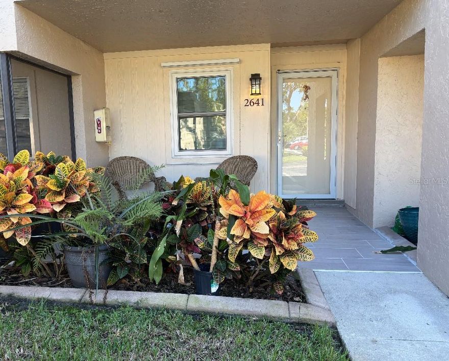This charming 2-bedroom, 2-bath first-floor corner condo offers an unbeatable Sarasota location just 5 miles from world-famous Siesta Key Beach!

Enjoy a newer kitchen with ample pantry space, a beautiful tile backsplash, granite countertops, and a thoughtfully designed kitchen layout ideal for cooking and entertaining. The in-unit washer and dryer are conveniently located just off the screened-in porch, which the owner has transformed into a delightful garden room with high-impact windows—a comfortable space to enjoy all year long.

A welcoming entry foyer opens to a covered front porch that stays shaded from direct sun, creating a pleasant spot to relax any time of day. Step outside to your private fenced courtyard, perfect for morning coffee or quiet evenings.

Community amenities include a large heated pool, clubhouse with fitness room, sauna, shuffleboard, activities center, and utilities such as cable, sewer, trash, and water—all covered in the HOA dues. A separate storage unit is also included for added convenience.

Ideally located just a few blocks from Riverview High School and one mile from Phillippi Shores Elementary, with shops, restaurants, and grocery stores all nearby.

(Note: The association does not allow pets unless you provide a valid service or emotional-support certificate from a licensed provider.)
