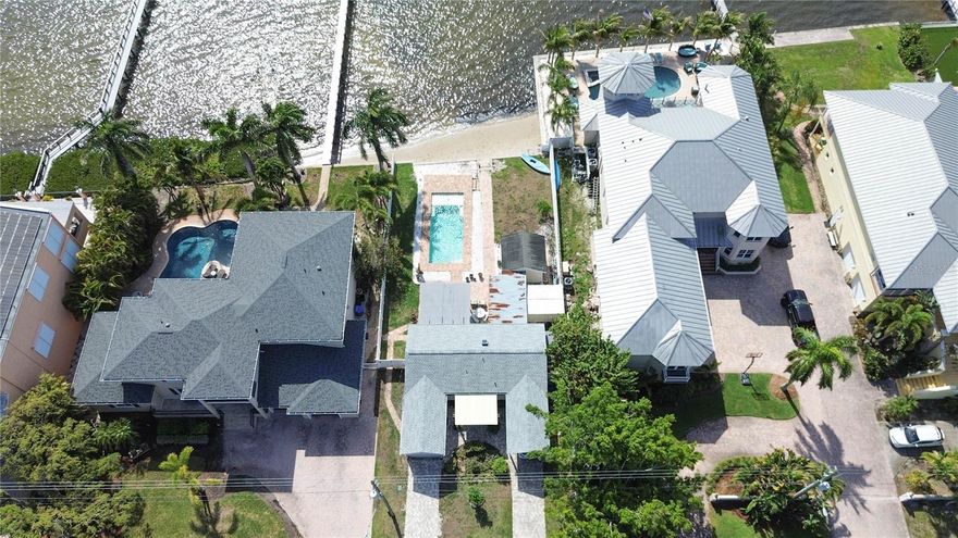 Nestled near the serene Weedon Nature Preserve, this exceptional waterfront property offers a rare opportunity in one of St. Petersburg’s most sought-after neighborhoods. Currently, it features a charming bungalow, a detached ADU, an inviting in-ground pool, and a seawall with a unique beach entry, perfect for embracing the ultimate Florida lifestyle. With space to add a dock, it’s a boater’s dream with effortless access to Tampa Bay’s sparkling waters.

Surrounded by stunning multi-million-dollar homes, this property is being sold for land value only, providing a blank canvas to craft your dream home or next investment project. Whether you imagine designing a custom luxury estate or capitalizing on its development potential, the possibilities here are as endless as the breathtaking views.

Conveniently located with easy access to both Tampa’s Westshore district and downtown St. Petersburg, this is your chance to claim a prime piece of waterfront real estate and create something truly extraordinary!