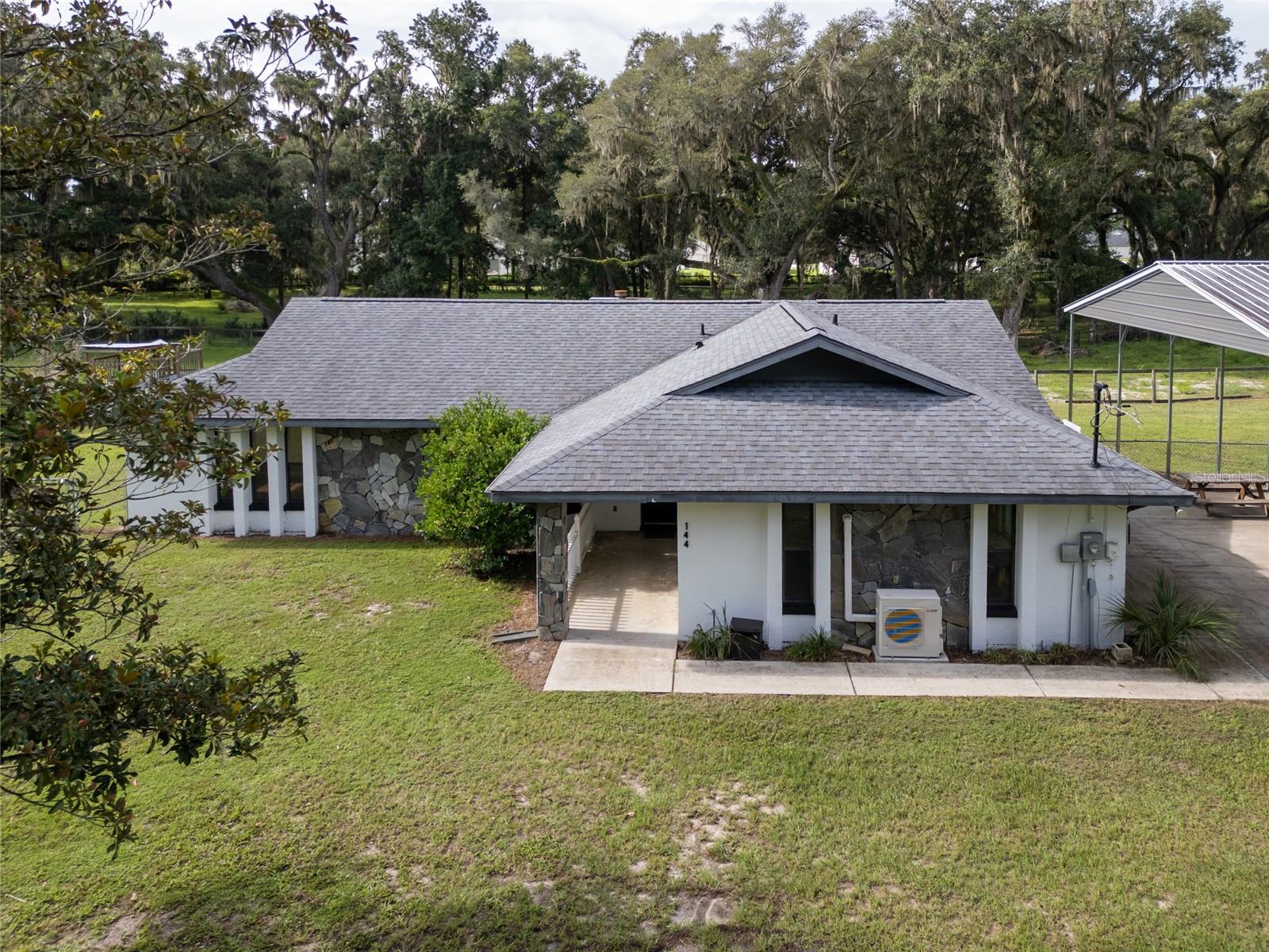 One or more photo(s) has been virtually staged. Looking for a dream slice of country life wrapped in convenience???? Whether you're envisioning a hobby farm, a weekend retreat, or a full-time homestead, this SE Ocala mini farm checks all the boxes:
Central Location: Nestled in SE Ocala, offering both tranquility and accessibility.
3 Acres Fenced: Ideal for livestock, gardening, or just enjoying open space.
Cozy Farmhouse: Features a fireplace for those crisp Florida evenings.
Glass-Enclosed Garage: Perfect for entertaining, a studio, or a sunroom.
Covered RV Carport: Spacious enough for your travel rig or extra vehicles.
Storage Building: Equipped with a mezzanine and electricity—great for tools, gear, or a workshop.
Lifestyle Possibilities
Equestrian Ready: Bring your horses and enjoy the open pasture.
Farm Fresh Living: Build a chicken coop, raise goats, or start a garden.
Outdoor Fun: Plenty of room for four wheelers, bonfires, and stargazing.
Why Ocala?
Ocala is known as the "Horse Capital of the World," and SE Ocala offers a rare blend of rural charm with proximity to shopping, dining, and medical facilities. You’re minutes from the World Equestrian Center, scenic trails, and vibrant community events.
