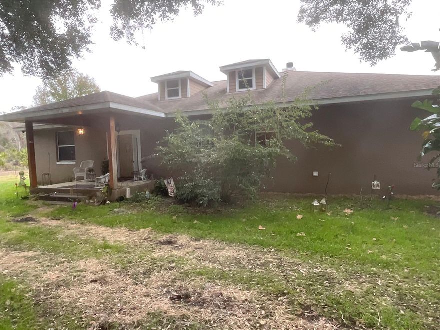 Live-Work-Play. This 2 acre property has all 3. The beautiful residential home has extra wood working throughout the house, spacious ceilings, lots of storage in your cedar lined closets. The property is zone CP (planned commercial) and a variety of uses are compatible. There are two climate controlled storage units on site (32' x 64') for your shop operations, classic cars or business operations. A Mother-in-Law Quarters also provides extra income potential. A five car carport is also on site providing plenty of protected parking and storage. Done for the day, drop a hook in the stocked pond, or better yet, invite the grandkids over. Ideal location for a contractor or trades operator to have everything on one lot. The adjoining acre is currently being used as a auto repair garage but the property is also for purchase, subject to the remaining lease.