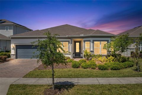 Photo of 13828 Tybee Beach Lane, Orlando, FL 32827 (MLS # O6405144)