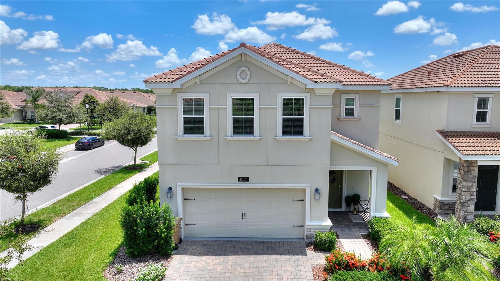 LIVE LIKE A CHAMPION! FULL GOLF MEMBERSHIP INCLUDED IN THE HOA! Welcome to resort-style living in the exclusive gated community of ChampionsGate Country Club! This beautifully maintained one-owner home is perfectly located just steps from the neighborhood pool and sits on a professionally landscaped corner lot. Boasting 3 spacious bedrooms and 2.5 bathrooms, this light-filled modern home shows like a model, with designer upgrades throughout. Enjoy 42" kitchen cabinets, elegant custom woodwork, quartz countertops, and sleek stainless steel appliances. The open-concept first floor is perfect for entertaining or relaxing with family, while the privately located upstairs master suite offers a peaceful retreat. ChampionsGate residents enjoy access to unparalleled amenities via golf cart-friendly roads. The Oasis Club features a 14,000 sq. ft. clubhouse with a full-service restaurant, movie theater, fitness center, game room, tiki bar, lazy river, and private cabanas. Homeowners also enjoy The Plaza—an exclusive clubhouse with its own restaurant (and a $75 monthly food credit), bar, two pools, fitness center, game room, and pickleball courts. The recently opened Retreat Club offers a full waterpark and even more recreational space. The HOA covers full golf and tennis/pickleball privileges, access to all amenities, gated security, lawn maintenance, cable, internet, phone and security monitoring. CDD and trash are included in the taxes—delivering a true maintenance-free lifestyle. Located just minutes from Central Florida’s top attractions, championship golf, dining, and shopping, this home presents an exceptional opportunity in one of the area’s most sought-after communities. Schedule your private showing today!