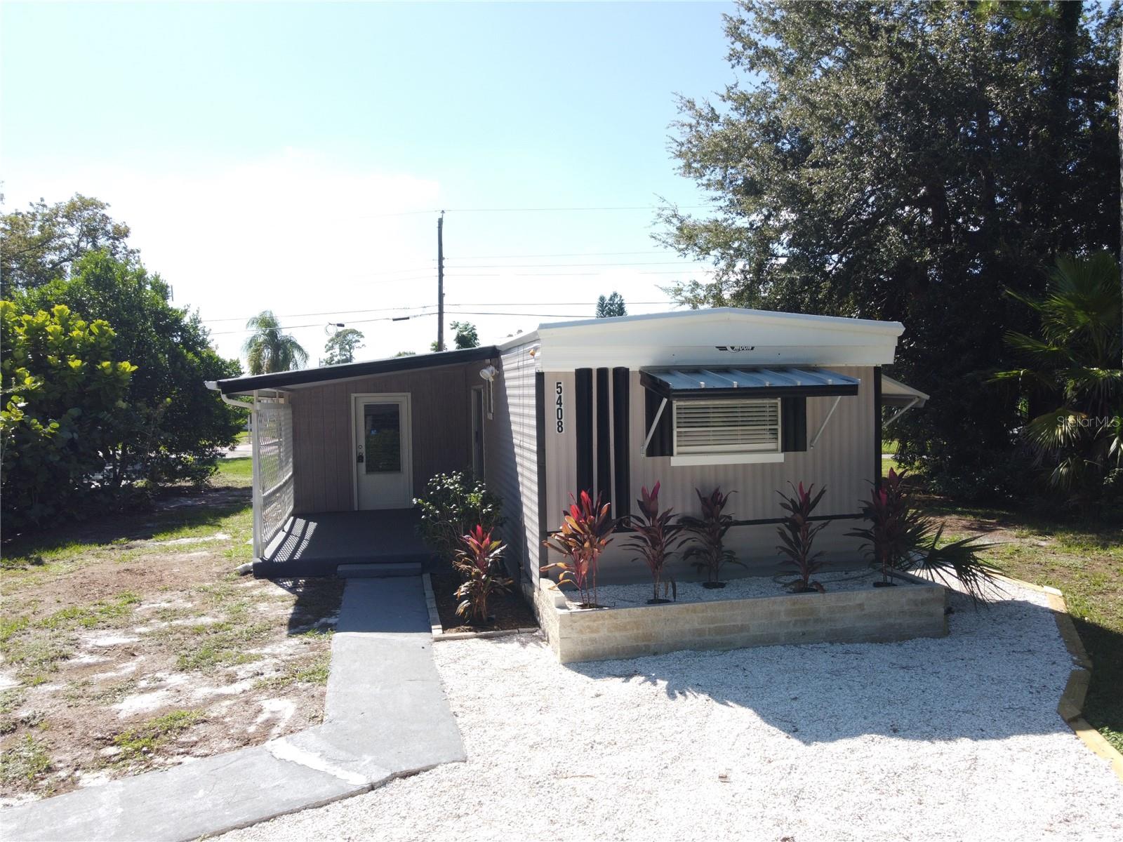**OWN YOUR LAND**NO LOT RENT**SINGLE WIDE MOBILE HOME**Lot of parking spaces in the front and back for your RVs, Toys, Boats and Many vehicles**OPTIONAL SELLER FINANCING with LARGE Down Payment **REMODELED**3 Beds X 2 Baths + Storage SHED **FAMILY ROOM is well insulated and has a built in closet and can be used as a 3rd bedroom** HIGH QUALITY KITCHEN CABINETS**2020 (2 Tons) Central AC unit **2016 ALUMINUM METAL ROOF **FRESHLY PAINTED outside with Interior walls MODERN KNOCK-DOWN FINISH**Updated Guest bath with double vanities**Stackable Washer & Dryer. Rear has a LARGE CARPORT with large drive way with lattice for privacy** SIDEWALKS** In the heart of Port Orange, close to shopping centers, medical offices, Hospitals and 10 min to the beach. This lot is high and dry with plenty of parking. All measurements are approximate but not guaranteed. HURRY UP...........Will Not Last Long.