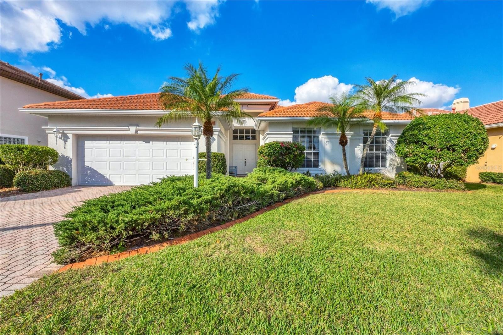 Live your best life within the award-winning gated community Lakewood Ranch Golf and Country Club. In Gleneagles, a maintenance-free neighborhood, includes lawn mowing, fertilizing, mulch, bush and tree trimming. Your time is your own! A paver brick driveway and entry walk lead you to a double entry door opening into an oversized formal living/dining room entertainment area. Should you need room for more guests, glass sliders open to a covered screened lanai, 12 feet deep by 30 feet wide with a tranquil preserve view. A natural gas tap opens outdoor grill and hot tub possibilities. Plus, room for a pool if preferred. A bright eat-in kitchen with a built-in bench includes white cabinets, lots of counter space and two separate pantry areas. It overlooks the family room including beautiful build-ins and sliding door to lanai. The extra-large main bedroom suite has dual sinks, two large walk-in closets, a soaking tub and walk-in shower. Two guest bedrooms with adjacent bath and walk-in shower. Laundry room with tub leads out to a two-car garage. Lakewood Ranch Golf and Country Club now offers four premier golf courses, three clubhouses, tennis and pickleball areas, plus a fitness and pool center. Gleneagles is minutes to Lakewood Main Street, Waterside at Lakewood Ranch and University Town Center, and all include retail shopping, dining and entertainment. Close to the area’s gorgeous beaches, hospitals, premium healthcare facilities plus A-rated and top private school opportunities. Easy commute to three international airports. Great price, premier location. Call for an appointment. This home is easy to see with short notice.