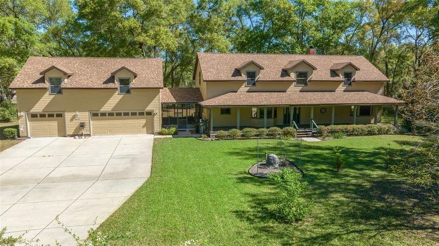 One or more photo(s) has been virtually staged. A DREAM COME TRUE... Welcome home to your 10 acre estate in Lady Lake!  GORGEOUS custom built home with  4 BEDROOMS, 3 BATHS, 3,996 SQUARE FEET, 3 CAR GARAGE, ON A TOTAL OF 10- ACRES IN THE HEART OF LADY LAKE! THE MINUTE YOUR EYES MEET THIS PROPERTY, YOU WILL FALL IN LOVE OVER AND OVER! THIS HOME HAS TONS OF UPGRADES - COME SEE FOR YOURSELF – HOME EVEN HAS A BRAND NEW ROOF (2023), HVAC (2021) AND A GENERAC ENTIRE HOME GENERATOR. AS YOU ENTER THE HOME, YOU WILL SEE THE BEAUTIFUL LIVING/GREAT ROOM WITH A WARM, WELCOMING FEEL. COZY UP BY THE WOOD BURNING FIREPLACE AS YOU GAZE AT LAKE ALICE.  THE EAT IN KITCHEN IS OPEN TO THE FAMILY ROOM AND JUST  AROUND THE CORNER IS A LARGE LAUNDRY ROOM.  THE ROOMY MASTER BEDROOM SUITE IS DOWNSTAIRS WITH LARGE MASTER BATH WITH DOUBLE VANITY AND STEP IN SHOWER.  DOWNSTAIRS YOU WILL ALSO FIND ANOTHER BEDROOM THAT CAN BE USED AS A HOME OFFICE.  THE OTHER TWO OVERSIZED BEDROOMS ARE UPSTAIRS WITH A FULL BATH. THE HOME HAS WOOD AND TILE FLOORING THROUGHOUT EXCEPT THE UPSTAIRS BEDROOMS WHICH ARE CARPETED.  THE FRONT AND REAR PORCHES ARE PERFECT FOR ENTERTAINING AND RELAXING! THE FENCED IN PORTION OF THE HOME HAS A SPRINKLER SYSTEM AND THERE IS IRRIGATION. THE PROPERTY IS GORGEOUS WITH LOTS OF SHADE TREES AND ROOM TO GROW! THE 3 CAR GARAGE HAS A BONUS ROOM ABOVE COMPLETE WITH LAMINATE FLLORING, AC SPLIT UNIT AND 4 OVERSIZED WALK IN STORAGE SPACES!  TO TOP IT OFF, THERE IS A LARGE BARN WITH ELECTRIC AND A CONCRETE FLOOR. THE DRIVEWAY LEADING TO THE PROPERTY IS UNIMPROVED. THIS PROPERTY IS LOCATED CLOSE TO SHOPPING, RESTAURANTS, AND THE VILLAGES; VERY CENTRALLY LOCATED IN CENTRAL FLORIDA AND APPROX. 1.5 HRS TO THE ORLANDO AIRPORT!  CALL TODAY FOR YOUR PRIVATE SHOWING!