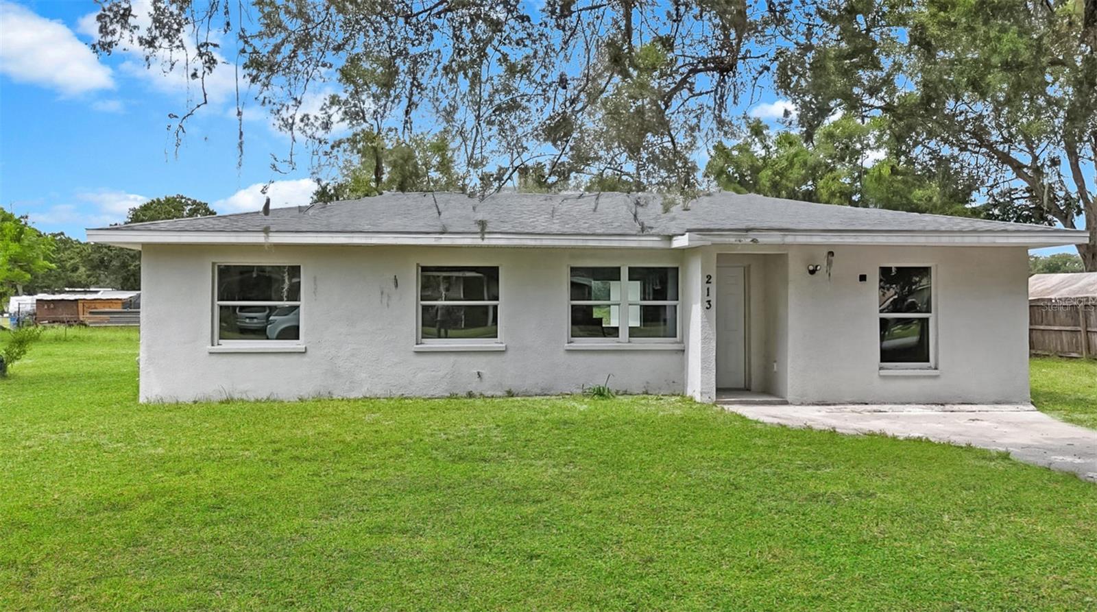 Charming and fully renovated, this 3-bedroom, 2-bathroom mid-century ranch offers the perfect blend of classic character and modern comfort. the single-story home is nestled in a quiet neighborhood of Auburndale and showcases a clean, simple stucco exterior with wonderful curb appeal. Inside offers plenty of living space features bright and open living areas enhanced by brand-new windows that fill the home with natural light. A brand-new roof and modern updates throughout provide peace of mind, allowing you to simply move in and enjoy.
Step outside to a large yard dotted with mature trees, offering a private oasis for relaxation and play. Whether you're hosting weekend barbecues, gardening, or watching Family and pets explore, this outdoor space provides endless possibilities. With its turnkey condition and welcoming atmosphere, this property is ideal as a starter home or for a growing family. It’s an inviting place where you can put down roots and make memories for years to come — all while blending mid-century charm with move-in ready convenience.