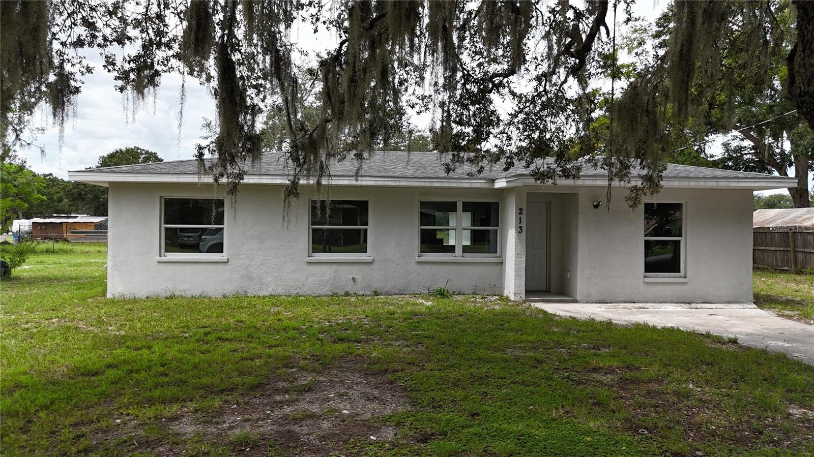Charming and fully renovated, this 3-bedroom, 2-bathroom mid-century ranch offers the perfect blend of classic character and modern comfort. the single-story home is nestled in a quiet neighborhood of Auburndale and showcases a clean, simple stucco exterior with wonderful curb appeal. Inside offers plenty of living space features bright and open living areas enhanced by brand-new windows that fill the home with natural light. A brand-new roof and modern updates throughout provide peace of mind, allowing you to simply move in and enjoy.
Step outside to a large yard dotted with mature trees, offering a private oasis for relaxation and play. Whether you're hosting weekend barbecues, gardening, or watching Family and pets explore, this outdoor space provides endless possibilities. With its turnkey condition and welcoming atmosphere, this property is ideal as a starter home or for a growing family. It’s an inviting place where you can put down roots and make memories for years to come — all while blending mid-century charm with move-in ready convenience.