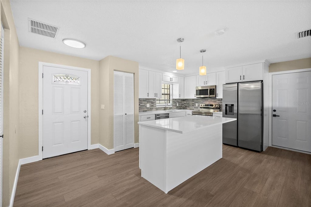 Photo of 977 Whiporwill Drive, Port Orange, FL 32127 (MLS # V4951108)
