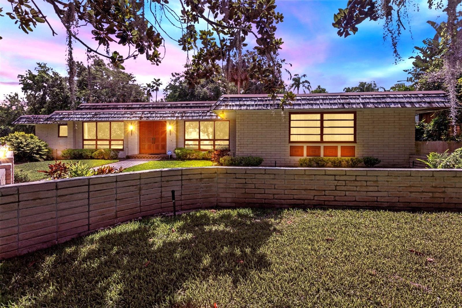 Charming Opportunity in Prime Winter Park – 446 Alberta Drive, Winter Park, FL! First time ever on the market and sits on a double lot that is .35 acres. Only a mile stroll to the famous Park Ave shops, dining and entertaining. Home site over looks Lake Osceola and the multi million dollar homes all around!! A neighborhood lot, a few doors down, allows residents to have walking access to Lake Osceola for paddle boarding, fishing, swimming or just to enjoy the view!! This home has only had one owner and is uniquely positioned not to see a next-door neighbor to your left or right!! Embrace the mid century modern style of this home or it is priced to be a tear down to build your dream home around the other multi million dollar homes.
Nestled in the heart of highly sought-after Winter Park, this spacious 4-bedroom, 2.5-bath home offers over 3,260 square feet of living space on an oversized .35 acre lot with gorgeous lake views—ideal for enjoying sunsets from a future second-story balcony or out your current kitchen window!! The 4 bedrooms are very generous in size, have ample natural light and each one has oversized closets. The bathrooms have been updated with style in mind. The luxury vinyl floors were recently installed along with new kitchen appliances.
Featuring a distinctive Mansard-style roof, this residence boasts strong architectural character and a versatile layout designed for modern living. Inside, you’ll find new luxury plank flooring, large windows that invite abundant natural light, and generously sized rooms with ample closet and storage space. Home offers a lot of character and charm with the present architectural features of a Chicago brick wall, ceiling accent beams and for the art lover a huge paneled art gallery wall!!
The home includes two separate living areas, a formal dining room, an eat-in kitchen, and an office area with abundant storage and desk work space —perfect for work-from-home needs, student study session or family organization. The 2-car garage adds both storage and convenience and has a large utility closet inside the garage to stay organized.
While the home is ready for your personal touch, it presents a rare chance to customize and elevate a spacious property in a top-rated school district, just minutes from parks, shopping, dining, and lakefront recreation. Whether you're looking to renovate, invest, expand upward, or build your dream home — the potential here is truly exceptional.