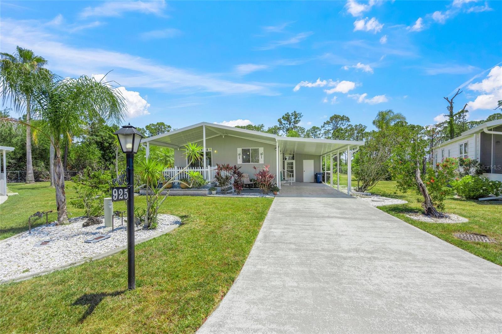 This delightful mobile home embodies the charm of a cottage rather than a traditional mobile residence. The front porch provides a sense of seclusion due to the pie-shaped and expansive lot, which is located on the final road within the neighborhood, resulting in minimal vehicular traffic. Additionally, the back patio offers a private retreat where one can enjoy the pleasant sounds of chirping birds.
Upon entering, the interior reveals a sense of spaciousness, highlighted by a living room measuring 17 feet in length. Both the kitchen and dining area are also adequately sized to accommodate various needs. Both bedrooms are furnished with a Queen-sized bed, generously sized dressers, and nice closet space.
The community features numerous amenities, including two swimming pools, several large lakes suitable for fishing, and courts for both tennis and pickleball. Furthermore, there are an array of activities available for residents to engage in. This home is available June 2025 - January 2026 and again in May 2026. 1 month minimum required by community.