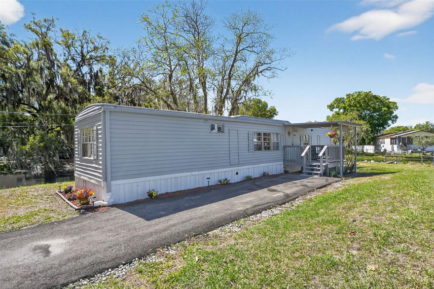 Waterfront living, major upgrades, and investment potential come together in this beautifully refreshed canal front property with direct access to the 2,000 acre private Lake Lowery. Whether you are looking for a primary residence, weekend fishing retreat, or income producing opportunity, this move in ready home offers the lifestyle, flexibility, and value buyers want.
Thoughtfully updated for comfort and peace of mind, the home features a newer roof completed in 2024, energy efficient A/C system in 2021, hot water heater and upgraded insulation in 2021, newer septic system in 2021, and hurricane strapping and stabilizers added in 2025. Inside, you will find luxury vinyl plank flooring throughout, a remodeled kitchen, two renovated bathrooms, updated electrical fixtures, and fresh interior paint that creates a bright, clean, modern feel.
Outside, the appeal continues with fresh exterior paint, updated skirting, a paved driveway completed in 2024, a newly installed fence for added privacy, and a spacious deck overlooking the canal that is perfect for relaxing or entertaining.
Conveniently located near shopping, dining, and Central Florida attractions, this property offers the perfect balance of peaceful waterfront living and everyday convenience. Schedule your private showing today.