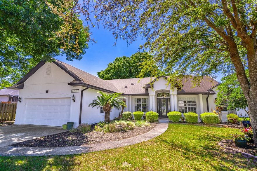 Welcome to this beautifully maintained home in the highly sought-after Tuska Ridge community in Oviedo. Known for its prime location, this neighborhood offers convenient access to shopping, dining, major highways, and is zoned for top-rated schools. Situated on a spacious ¼-acre lot with mature trees providing natural shade, this home offers both comfort and functionality. A welcoming front porch creates the perfect spot to enjoy a morning coffee. Inside, you’re greeted by soaring vaulted ceilings and an abundance of natural light. The formal living and dining areas feature wood flooring and a sliding glass door that opens to the covered lanai, creating a seamless indoor-outdoor flow. A flexible fourth room at the front of the home is ideal for a home office or additional living space. The primary suite occupies the right side of the home, offering privacy and generous space. It features wood flooring, large windows and a sliding glass door for natural light, along with an en-suite bathroom complete with dual sinks, a soaking tub, separate shower, and two closets. At the center of the home, the kitchen serves as a true focal point with wrap-around granite countertops, 42” cabinetry, stainless steel appliances, and ample lighting. It opens to the spacious family room and an additional dining area overlooking the backyard—perfect for everyday living and entertaining. Two additional bedrooms are located on the opposite side of the home and share a Jack-and-Jill bathroom. The indoor laundry room is conveniently located just before the entrance to the oversized two-car garage. Step outside to enjoy a large screened-in covered lanai and a fully fenced backyard, offering privacy and plenty of space to relax or entertain. Recent updates include a brand new exterior paint job, re-plumbed with PEX, HVAC replaced in 2023, and a new refrigerator—providing peace of mind for the next owner.