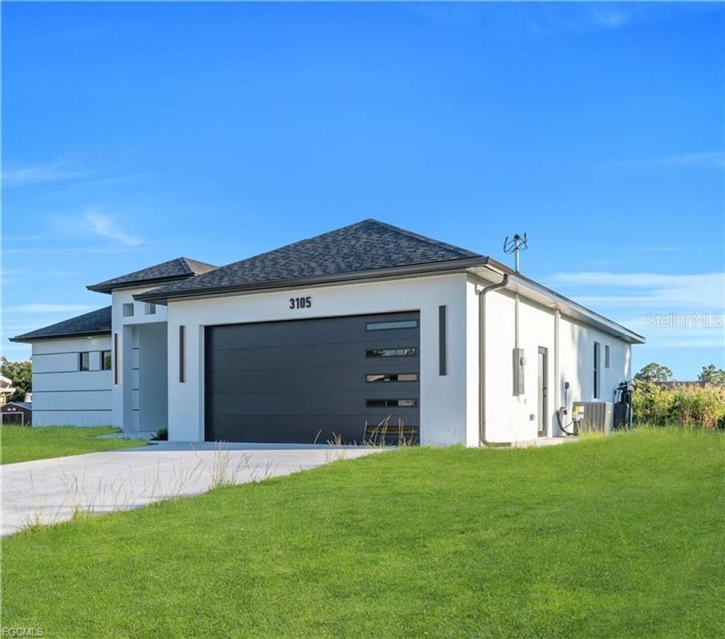 Photo of 3105 28th Street SW, Lehigh Acres, FL 33976 (MLS # A4678511)