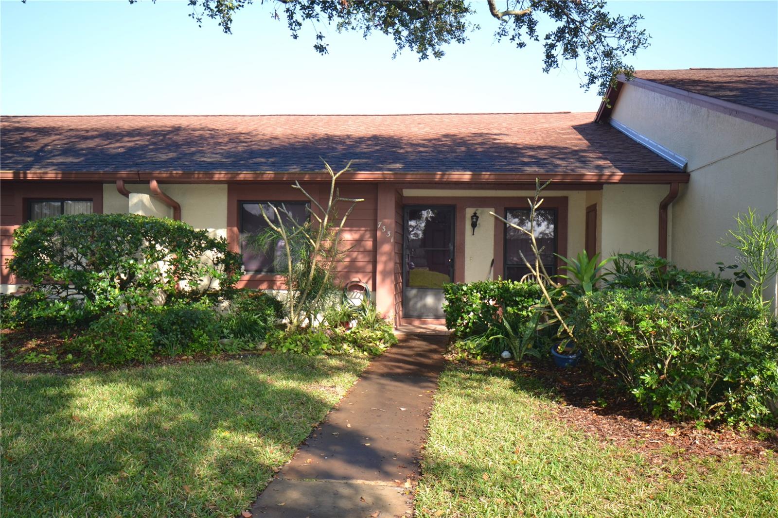 Call to see ! Welcome to Glenwood Village. Step onto your relaxing front porch, where you can enjoy the beauty of nature or catch up with a neighbor. You'll love the tranquil water view from the front patio, or take a stroll through the peaceful surroundings. As you enter, you'll be greeted by a bright and airy living space and kitchen with beautiful NEW stainless steel appliances, along with plenty of cupboard and drawer space. There's even room for a breakfast table and chairs. The open living/dining room combination flows right out into a sunny lanai thats been upgraded with windows, creating an all-season room for extra space year-round. The bedrooms are split for privacy, each with its own bathroom. The Primary Bedroom features a spacious closet and a bathroom with a gentle step-in shower and a lovely vanity area. The Guest Bedroom has convenient access to the main bathroom, complete with a shower and tub. With no rear neighbors, you can enjoy ultimate privacy while grilling on your patio. Additional perks include extra storage in an outside closet on front porch area, a covered carport, visitor parking just steps from your door. There is a clubhouse and recreational facilities, including a heated pool, tennis courts, fitness center, and more, theres always something to do. Golf is extra. Plus, your monthly rent covers trash, cable TV, internet, pest control, and all community amenities. For those who enjoy golf, access to the Beacon Woods golf course is available for an additional fee. Conveniently located near shopping, dining, and entertainment on Hwy 52, this villa offers everything you need to enjoy a comfortable, active lifestyle. Call today to see this wonderful villa in person! ONLY 1 PET ALLOWED BY ASSOCIATION RULES 35 LBS OR LESS
