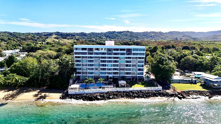 Fourth-floor residence at Pelican Reef Condominium in Rincón, Puerto Rico, offering unobstructed ocean views and effortless coastal living. This turnkey 2-bedroom, 2-bath unit is filled with natural light and refreshing ocean breezes, thoughtfully positioned to capture both privacy and sweeping ocean views, with front-row sunsets from your own space.
Residents enjoy access to a pool, shared laundry facilities, and one assigned parking space. Perfectly situated walking distance to pickleball courts, a running track, gym, and the local sports complex, the property sits in one of Rincón’s most active and convenient lifestyle corridors. Just minutes away, you’ll find restaurants, pharmacies, schools, and direct access to Road 115 for easy connectivity.
Whether as a primary residence, vacation retreat, or income-producing investment, this offering presents a compelling blend of location, views, and turnkey convenience in one of Rincón’s most sought-after markets.