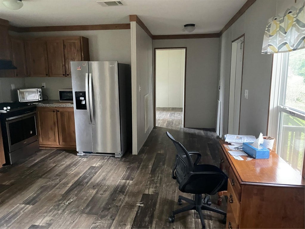 Photo of 3275 SE 133rd Place, Belleview, FL 34420 (MLS # O6448876)