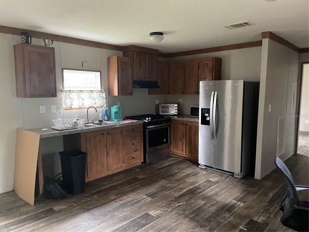 Photo of 3275 SE 133rd Place, Belleview, FL 34420 (MLS # O6448876)