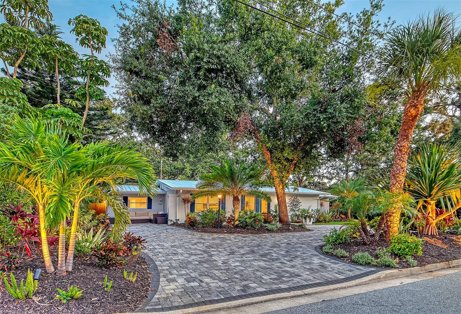 Welcome to Sapphire Shores, this property is on almost a quarter acre. This stunning 2023-25 completely remodeled Mid Century Modern residence is nestled in the highly sought-after Indian Beach/Sapphire Shores community of Sarasota. No expense was spared in transforming this gem into a luxurious haven, offering 4 bedrooms, 3 baths. Two outdoor relaxation areas, and a privacy fenced yard. The in-law suite with full bath, is perfect for guests, Airbnb, or a work-from-home office. New metal roof, aluminum soffit, and gutters, new AC system, hurricane impact windows and doors. New Kitchen, and appliances, New stackable washer and dryer. Newly furnished, and equipped. Experience the ultimate Gulf Coast lifestyle with this exceptional home, located West-of-the-Trail, mere minutes from downtown Sarasota, St. Armand’s Circle, and the pristine sands of Lido Beach. Enjoy the perfect blend of timeless elegance and modern convenience in this exquisite property. Step inside to discover a thoughtfully designed interior, boasting high-end finishes, an open-concept layout, and an abundance of natural light. The spacious living areas flow seamlessly, creating an ideal setting for both relaxation and entertaining. The gourmet kitchen features state-of-the-art appliances, custom cabinetry, and stunning Blue Onyx countertops, making it a chef’s dream. Come take a new look! Move in Ready!