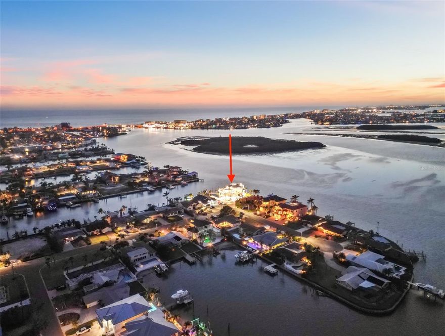 CAT 5 RATED HURRICANE HOME Ultra-Modern 6,428 Sq Ft Concrete Smart Home | Glass Elevator, Solar Average Electric Bill $125/Mo , Dock, Rooftop & Resort-Style Living
Crafted with precision and built for a lifestyle of luxury, innovation, and resilience, this 6,428 sq ft all-concrete smart home redefines modern waterfront living. Every element of this architectural masterpiece is engineered for performance, efficiency, and ease—from the poured concrete floors and roof to its expansive balconies that blend indoor and outdoor living.
A four-story, oversized glass elevator with a 1,400 lb capacity serves as the home’s vertical centerpiece, connecting each level with sleek sophistication. Power and utility are secured with a 48kW Generac generator, 1,000-gallon inground propane tank, four 200-amp electrical panels (including one dedicated to the generator), and 71 high-efficiency 400-watt solar panels, dramatically reducing monthly electric costs.
Security and comfort are built in with 1 1/4” thick, triple-Pane Kevlar-reinforced windows, automated blinds and drapes, and four 5-ton AC heat pump units for zoned climate control. The high-performance design continues outdoors with electric entry gates—featuring a custom modern abstract design, remotes, and a lighted keypad—and two vehicle turntables, eliminating the need to ever back out of the garage.
The resort-style 40,000-gallon pool features a beach entry, jacuzzi, laminar jets, and LED lighting, framed by an outdoor kitchen and a 20' modern abstract statue, offering both art and ambiance to your backyard entertaining. Head up to the rooftop jacuzzi with panoramic views, with plumbing already in place for a rooftop kitchen.
Built with the waterfront lifestyle in mind, the 265 ft seawall was raised 18” with a 36” concrete cap, leading to a brand-new (2025) dock with a 40,000 lb Decko lift, water, electric, and the capacity to accommodate a 135’ yacht with a 20’ beam. A walkway entry completes the yacht-ready setup.
With every square foot thoughtfully designed and fortified, this home offers a level of craftsmanship and innovation rarely seen, delivering the ultimate in smart luxury living.