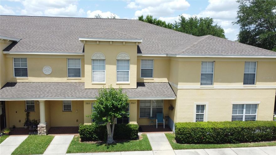 Short Sale. Welcome home to this beautifully appointed 2-bedroom, 2.5-bath townhome with a versatile loft, ideally located in the heart of Zephyrhills. Offering one of the community’s larger floor plans with 1,561 sq ft, this home combines space, style, and functionality perfect for homeowners or investors alike. Step inside to find a bright, open layout featuring a stunning kitchen with ceramic tile flooring, stainless steel appliances, granite countertops, and a striking stone backsplash. The breakfast bar flows seamlessly into the dining area, highlighted by a custom wood accent wall that adds warmth and character. The spacious living room is perfect for relaxing or entertaining, with sliding glass doors leading to a screened-in patio overlooking a peaceful shared green space. A convenient half bath with in-unit laundry completes the first floor. Upstairs, retreat to the generously sized primary suite with a private bath and oversized soaking tub. A second bedroom, full guest bath, and a flexible loft space ideal for a home office, media room, or guest area provide plenty of versatility. Enjoy resort-style community amenities including a sparkling pool with separate jacuzzi, fenced playground, open green spaces, and a pet-friendly atmosphere. Centrally located just minutes from shopping, dining, and major roadways, this home offers both comfort and convenience in one attractive package.