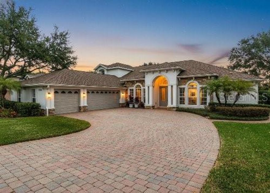 HUGE PRICE REDUCTION! MOTIVATED SELLER!!  Stunning 5BR/4BA Luxury SMART HOME in 24-Hr Guard-Gated Buckingham Estates. Step into this modern 5-bedroom, 4-bath home featuring an office, loft/bonus room, media/theater room, 3-car garage, and a sparkling custom saltwater pool. Enjoy true peace of mind with a NEW ROOF (Nov 17, 2025), NEW AC units, and a NEW Water Heater installed before closing. The moment you enter, you’re welcomed by a spacious living room with tray ceilings, crown molding, and sweeping views of the screened lanai, custom pool, and serene conservation area - an ideal setting for everyday living and entertaining. A well-designed 3-way split floor plan offers excellent privacy, with four bedrooms (including the primary) on the first floor. The dedicated media/theater room is fully equipped with leather seating and built-in speakers. Elegant finishes include French doors, plantation shutters, built-ins, and a 3-car garage with EV charging. The owner’s suite opens directly to the lanai and features a large walk-in shower, soaking tub, dual sinks, a separate vanity, and an oversized walk-in closet. Outdoor living shines with a Newly Screened Lanai (2021), Custom Saltwater Pool (2015), Red Cedar Pergola (2018), and a full Summer Kitchen with stainless-steel grill, hood, refrigerator, and hot/cold sink. Solar Panels (2022) will be paid off at closing. The chef’s kitchen includes extensive cabinetry, granite counters, a large center island, wine rack, convection oven/microwave combo, and a gas cooktop—perfect for hosting and family gatherings.  With no rear neighbors, smart-home upgrades, luxury finishes, and resort-style outdoor amenities, this home offers the perfect balance of comfort, privacy, and modern living. Don’t miss your chance - schedule your private showing today!