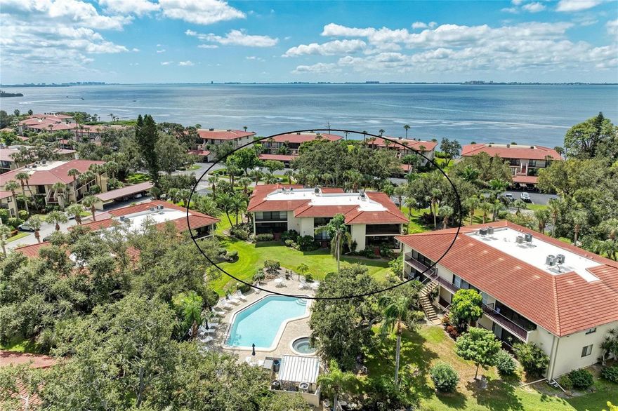 NO ASSESMENTS AND ROOFS REPLACED JUST 3 YEARS AGO.--PEEK OF THE SARASOTA BAY, right outside your front door. This sunny 2 bedroom, 2-bath (second floor optimal for viewing) has a peek-a-boo view of Sarasota Bay from your Front sitting area. View the famous western Florida Sunsets every day from this your own piece of paradise.  This condo is situated in and around Palm trees, lush tropical landscaping, lagoons, wildlife and 100 year old Oak trees that canopy so much of the community giving it the name  (WILD OAK BAY). Wild Oak Bay has a resort-like ambiance, truly paradise. Its the type of place where you just cant help yourself but want to go out and walk to enjoy the beauty of this hidden community every day. The North view can be viewed from the kitchen through the Livingroom and lanai overlooking the community pool and a beautiful lake. The front door and front balcony face south but receives protection from the sun from   mature oak trees that canopy over your viewing area and allows enjoyable seating all day long with endless sunsets and peaks of Sarasota Bay. The unit comes fully furnished with everything you need to start enjoying the Florida lifestyle, just bring some clothes and your swimsuit. Recent improvements include a newer HVAC system (2022), water heater (2022), and wood-look ceramic tile on the rear lanai (2023), Updated guest bathroom (2024). A touchpad lock is installed for your convenience, so you will not have to worry about forgetting your key. Less than 5 minutes away are the semi-private IMG Golf and Country Club, IMG Sports Academy, and Bradenton Tennis/(pickleball) Club. The IMG golf course does not require memberships to schedule and play a round just minutes down the road. Many beaches are twenty minutes west; and the cultural mecca of Sarasota, is twenty minutes south. Terrific for seasonal or full-time living. This is the picture-perfect Florida condo you’ve been hoping to find in the rarely available south end of Wild Oak Bay.
This condo really has something special and you will feel it to the moment you walk in the door. Why rent... The American dream is right here waiting for you.  Grab this before the snowbirds come... You will be so glad you did!