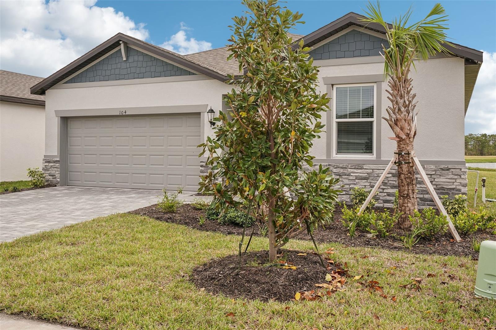 Brand new, energy-efficient home available NOW! Enjoy a peaceful pond view from the backyard of this brand new home. There are many amazing upgraded features inside and out! From the impact-resistant glass windows and front door to the 6x36 wood look floor tile that flows throughout the entire home. The Classic Whi design collection finishes have soft timeless neutrals such as Harbor cabinetry, Carrara Roma quartz countertops in the kitchen and primary bath, a 3x12 textured whi subway tile kitchen backsplash, and a beautiful 12x24 Carrara Matte primary bath floor and shower wall tile. Blck hardware and faucets throughout provide a nice contrasting element to the design. The exterior elevation features stone accents, a paver driveway, and beautiful landscaping for added curb appeal. Convenient to I-75, this community offers easy access to plentiful shops and restaurants in downtown Sarasota and Venice. Residents will enjoy fabulous amenities that include a clubhouse, resort-style pools, fitness center, sports courts and more. Explore Magnolia Bay and see the benefits of a new home today. Each of our homes is built with innovative, energy-efficient features designed to help you enjoy more savings, better health, real comfort and peace of mind.