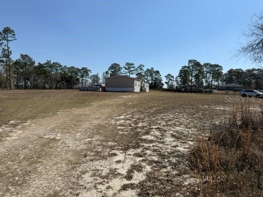 Photo of 7551 SE 131st Avenue, Morriston, FL 32668 (MLS # OM718851)