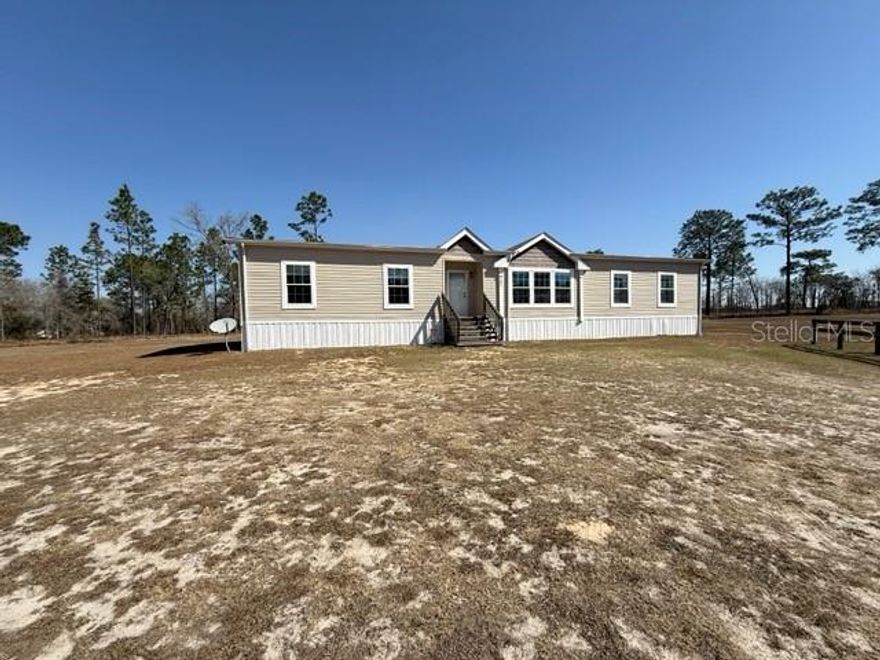 PROFESSIONAL PHOTOS COMING SOON!!
Welcome to 7551 SE 131st Ave in Morriston, FL 32668 a beautiful 2019 home located in Triple Crown Farms, offering space, privacy, and modern comfort on 5 acres all with NO HOA and situated in a no flood zone.

This spacious 2,142 sq ft home features 3 bedrooms and 2 bathrooms with an inviting open layout designed for comfortable everyday living. From the moment you walk in, you’ll notice the upgraded finishes that make this home stand out 9-foot ceilings, textured ceilings, elegant crown molding and chair rail throughout, and beautifully cased windows that add warmth and character to every room.

The living room is the heart of the home, complete with a cozy electric fireplace perfect for relaxing evenings. The home offers carpet throughout the main living areas and bedrooms, with durable vinyl flooring in the kitchen and bathrooms. You’ll also appreciate the abundance of storage space, giving everything its place.

Step outside and enjoy your own private retreat with an above-ground pool, ideal for Florida summers and weekend gatherings. With 5 acres, you have the space and freedom to truly enjoy country living while still being conveniently located near everyday amenities.

Located in Morriston’s desirable horse country, this property is approximately 25–30 minutes from the World Equestrian Center in Ocala, making it a fantastic option for equestrian enthusiasts or those who enjoy world class events and dining. You’re also a short drive to Williston for shopping and restaurants, and within easy reach of Ocala and Gainesville.

Offered at $365,000, this property combines modern features, acreage, and an unbeatable location without HOA restrictions.

If you’ve been searching for space, privacy, and a move-in ready home that truly stands out this is it. Schedule your showing today and experience everything this property has to showcase.
