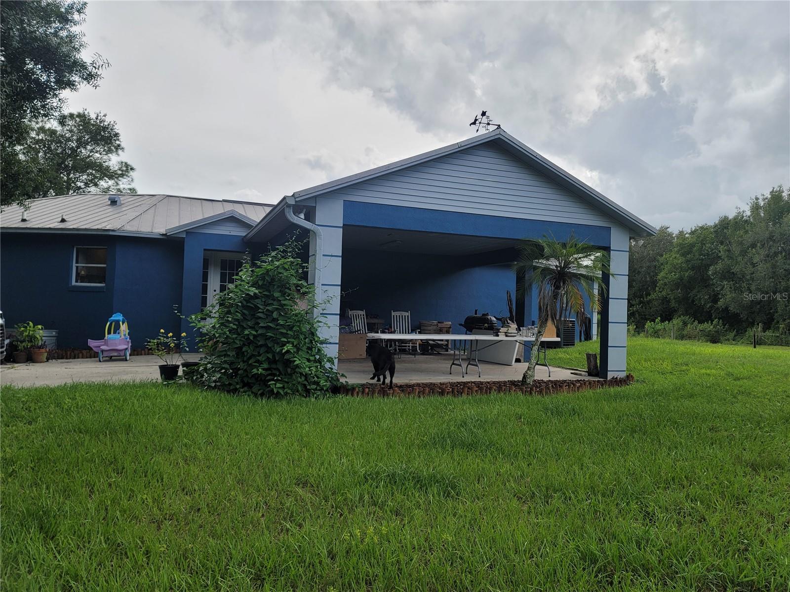 Country setting on 9.87 acres this adorable 1,627 square foot octagon shaped home with 2 bedrooms, 2 full bathrooms with showers and walk-in closets, a large living room and an inside laundry room. Screened back porch that overlooks an above 15x32 ground pool, with a view of acreage. 2 car carport off the front of home overlooking acreage as well. Bring your horses, cows and farm animals to this cleared land with some trees. Completely fenced in, small horse stall, chicken coop and Pole barn on property. Metal Roof, Septic, the Well and AC/Duct were updated 2 years ago.