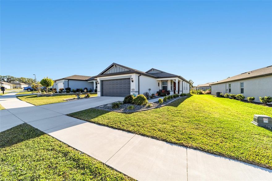 Welcome to this like-new 2-year-old popular Candlewood model in the highly sought-after Del Webb Stone Creek, one of Ocala’s premier 55+ active adult communities. This beautifully maintained home offers 2 bedrooms, 2 baths, and a versatile flex room—perfect for a home office, den, or guest space. The popular open and split-bedroom floor plan showcases luxury vinyl plank flooring throughout the main living areas, carpet in the bedrooms and flex room, and abundant natural light.
The chef’s kitchen features soft-close cabinetry, stone countertops, an upgraded tile backsplash, stainless steel appliances, and pendant lighting over a spacious island ideal for entertaining. The primary suite includes an upgraded walk-in shower, dual sinks, and a generous closet.
Additional highlights include double doors on the flex room, keyless front entry, custom blinds, ceiling fans, whole-home surge protector, water softener system, and an automatic A/C cleaning system for comfort and efficiency. The garage is a true bonus featuring a 4-foot extension, insulated garage door, and is fully air-conditioned for year-round comfort. It also includes an epoxied floor, insulated attic, and floor mats for golf cart parking.  The lanai features an epoxied floor and ceiling fan creating a seamless transition to the outdoors.
The professionally landscaped yard is complete with sod, pavers, edgers, stones, plants, and shrubs, offering outstanding curb appeal and easy maintenance. Enjoy the peace of mind of modern construction plus the lifestyle amenities that make Stone Creek so desirable—golf, resort-style pools, fitness center, pickleball, social clubs, and so much more! Move right in and start living your best life today!