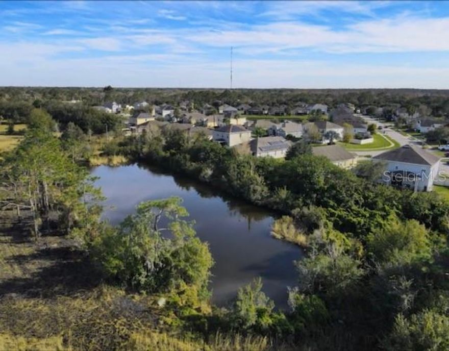 WOW! 4.94 Acres with a Private Pond!
This spacious vacant lot offers the perfect setting to build your dream home or vacation retreat. Create your own estate with a private gated entry, tennis or basketball court, playground, gazebo, or lush gardens with fruit trees and tropical landscaping—then unwind by your own pond.

With City of St. Cloud approval, the property may also allow for the development of additional single-family homes. Surrounded on three sides by established residential neighborhoods, it’s ideal for building, investing, or holding for the future.

Conveniently located just 3–5 minutes from shopping, schools, and only a short drive to theme parks and attractions. Utilities include electric and septic with a 35-foot entryway to the property.