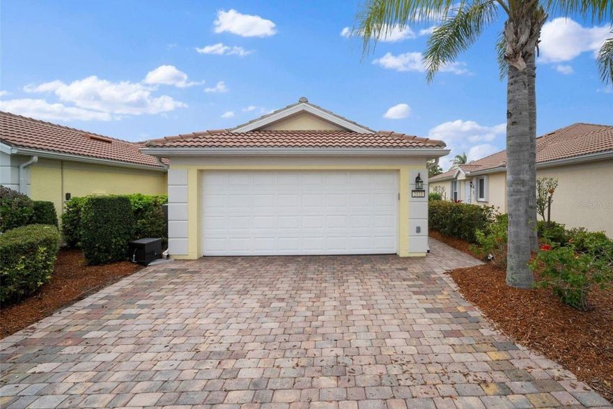 Welcome to this impeccably maintained villa in the highly sought-after Isles of Sarasota, a premier resort-style community in Palmer Ranch. This light-filled residence features an inviting open floor plan with three bedrooms, two bathrooms, and a two-car garage, providing plenty of space for both everyday living and entertaining. The spacious living room showcases tile flooring, upgraded lighting, and sliding glass doors that open to the oversized screened lanai with newer pavers, creating seamless indoor-outdoor living. The well-appointed kitchen is designed for both style and function, featuring granite countertops, stainless steel appliances, and a convenient closet pantry.

The primary suite is a peaceful retreat with newer flooring, plantation shutters, updated lighting, and a ceiling fan. A second bedroom also offers newer flooring and lighting, while the third bedroom with French doors provides flexibility as a guest room, den, or home office.  Residents of the Isles of Sarasota enjoy an amenity-rich lifestyle featuring a geothermal-heated resort-style pool, a state-of-the-art fitness center, a beautifully renovated clubhouse, four lighted Har-Tru tennis courts, as well as pickleball, bocce, and basketball courts.  With an onsite activities director and a welcoming community atmosphere, to enjoy everything from tennis and pickleball leagues to trivia nights, yoga classes, water aerobics, bridge groups, happy hours, and special events.  Ideally located just minutes from world-famous beaches, the Legacy Trail, shopping, dining, Costco, the new Publix, cultural venues, and Sarasota Memorial Hospital, this home offers the perfect combination of tranquility and convenience. This is more than just a home—it’s your private retreat in the heart of Sarasota’s resort lifestyle. Schedule your private showing today and start living the Florida dream.  More pictures coming soon