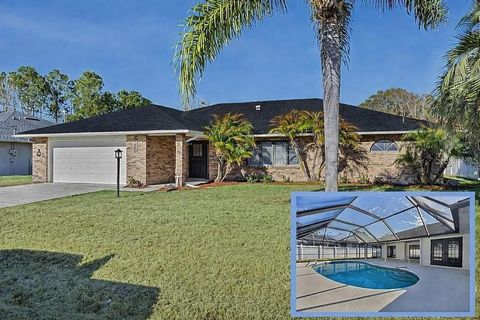 Photo of 7 Bird Land Place, Palm Coast, FL 32137 (MLS # FC315826)