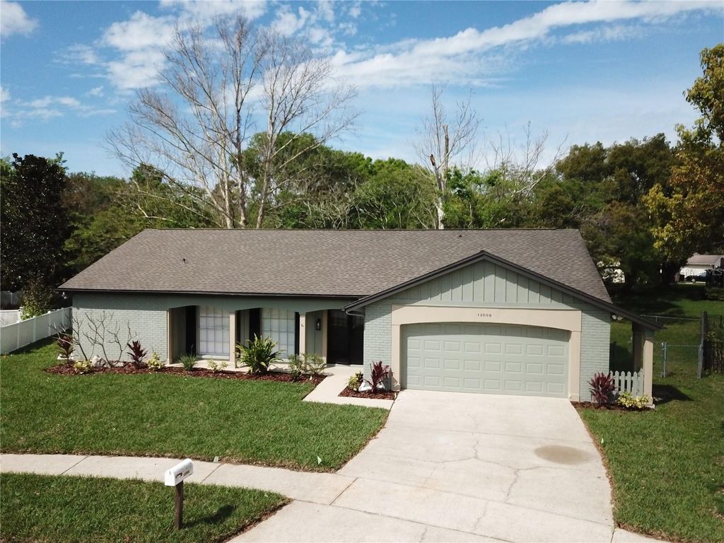 Photo of 13009 Sandburst Lane, Hudson, FL 34667 (MLS # TB8487358)