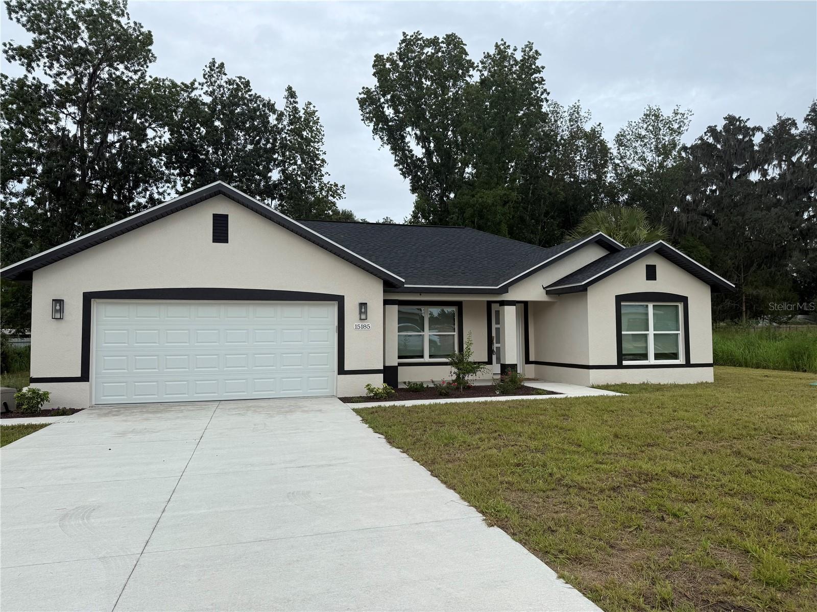 NEW CONSTRUCTION MOVE-IN READY!! Located in the family-friendly neighborhood of Summerfield Terrace this 4BR/2BA is within arm's length of THE VILLAGES, Mulberry Grove Plaza, Ocala, shopping, dining, schools, and much more. Situated on an OVERSIZED .31 acre lot this home offers plenty of space to stretch out arms without feeling stacked. Comprised of a total of 1,694+/- sqft under air this home features a split floor plan with vaulted ceilings, tile flooring, an inside laundry room, a 2-car garage, and a patio. The kitchen features quartz countertops, stainless steel appliances, a kitchen island, and soft-close cabinetry. The master bedroom is enhanced with a walk-in closet, and an ensuite including his/hers sinks, and a private lavatory and a seamless walk-in shower. The spare bedrooms are spacious with a shared hall bath and linen closet. With plenty of space for your family, you'll love everything that this home has to offer with a great neighborhood. Move-in Costs are First month's rent ($2,300) and Security Deposit ($2,300). No Smoking.