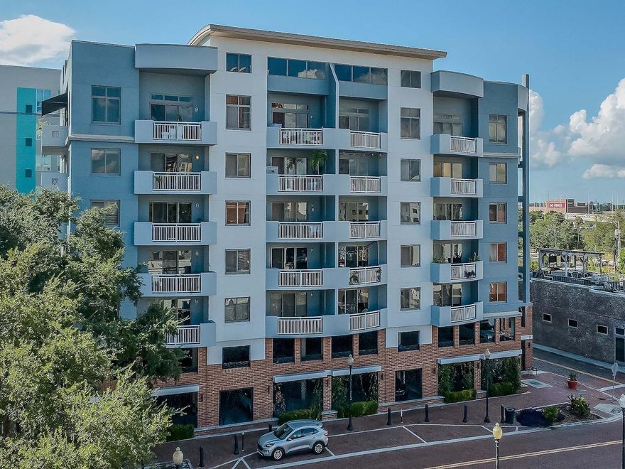 Welcome to The Residences of Franklin Street - considered one of the special gems of downtown Tampa.  Experience contemporary urban living in this beautifully maintained residence with a thoughtful open floor plan and refined finishes throughout. Hardwood bamboo flooring flows through the main living areas, complemented by neutral tones and abundant natural light. The kitchen features granite counters, stainless steel appliances including a French door refrigerator, a Sub-Zero wine fridge with 78-bottle capacity, and a convenient breakfast bar—perfect for casual dining or entertaining.  A sizeable foyer welcomes you into the home, where you will also find a tasteful powder room with a custom vanity and mosaic tile accent wall. The spacious living and dining areas open to a balcony with north and east views, creating an inviting space for gatherings. An office nook and in-unit laundry add to the home’s functionality.  The owners’ suite provides a serene retreat with a private east-facing balcony, blackout window treatments, and an expansive walk-in closet. The primary bath features a marble double vanity, deep soaking tub, a walk-in shower tiled to the ceiling, and a separate WC.  The large secondary bedroom offers an ensuite bath, linen closet, and balcony access.  This gently lived-in home has been lovingly maintained by its original owners. Two premium parking spaces and a storage unit are included.  Residents enjoy a newly renovated lobby, secure building access, and a full suite of amenities: an 8th-floor fitness center, rooftop pool and lounge area, and a welcoming community room with floor-to-ceiling windows and a full kitchen.  Ideally located just a short distance from 3 Michelin-starred restaurants—Rocca, Ebbe, and Kosen—as well as the Arts District, Riverwalk, Straz Center, Tampa Museum of Art, Armature Works and so much more.  Convenient guest parking is available on Franklin St (15-minute limit) and a nearby loading zone on Royal St offers up to one hour of free parking.