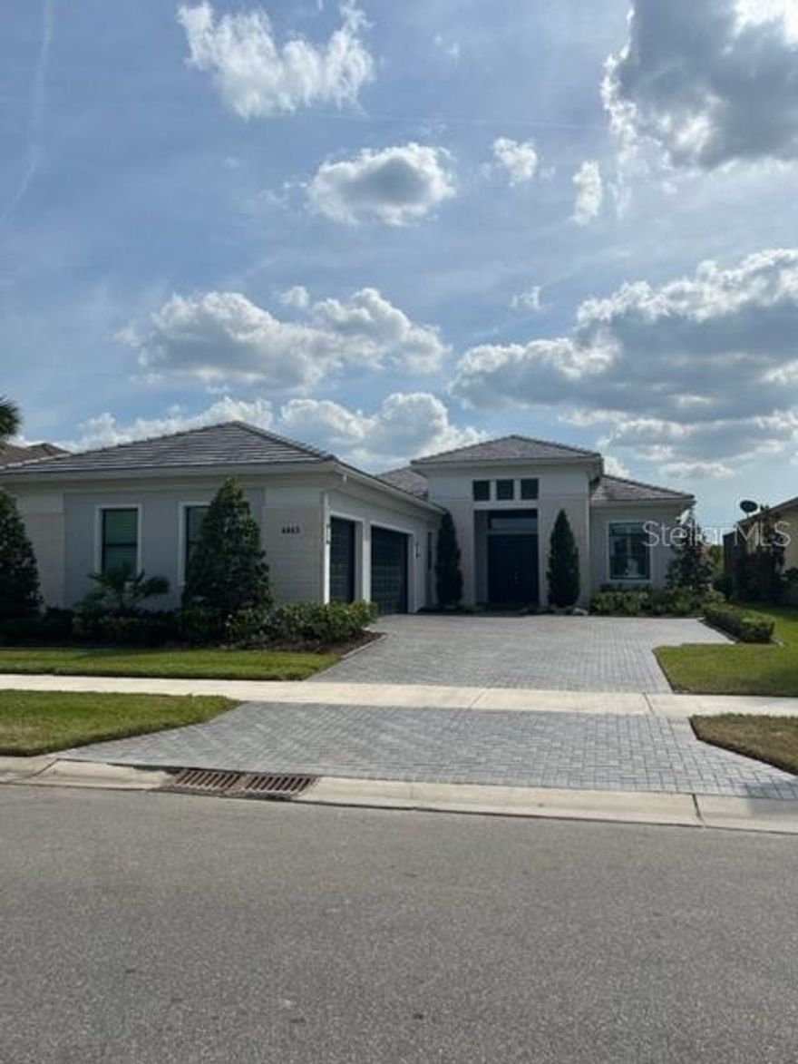 Model perfect Renoir floor plan on private lake lot in popular Artistry of Sarasota* This immaculate maintenance free home features 2758 sq. ft. under air with 3 bedrooms & 2 1/2 baths, formal living room retreat, great room & formal dining room with courtyard 3 car garage* Main flooring is level 5 (Millhaven Satin Calcutta Delight) with the look of marble* Very open floor plan with high ceilings* Kitchen is a chef's delight with white cabinets, quartz counters, upgraded stainless appliances & gas cooktop* Great room has built in wet bar with wine frig* Newly screened lanai with serene lake views with plenty of room for a pool* Very quiet cul de sac lot* Plantation shutters & Hurricane shutters* Paver brick driveway, walkway & lanai* Upscale amenities include:  clubhouse that with a full fitness center  yoga & aerobics studio, resort-style heated pool, expansive poolside sun deck, community room, playground and sports courts & walking trails*