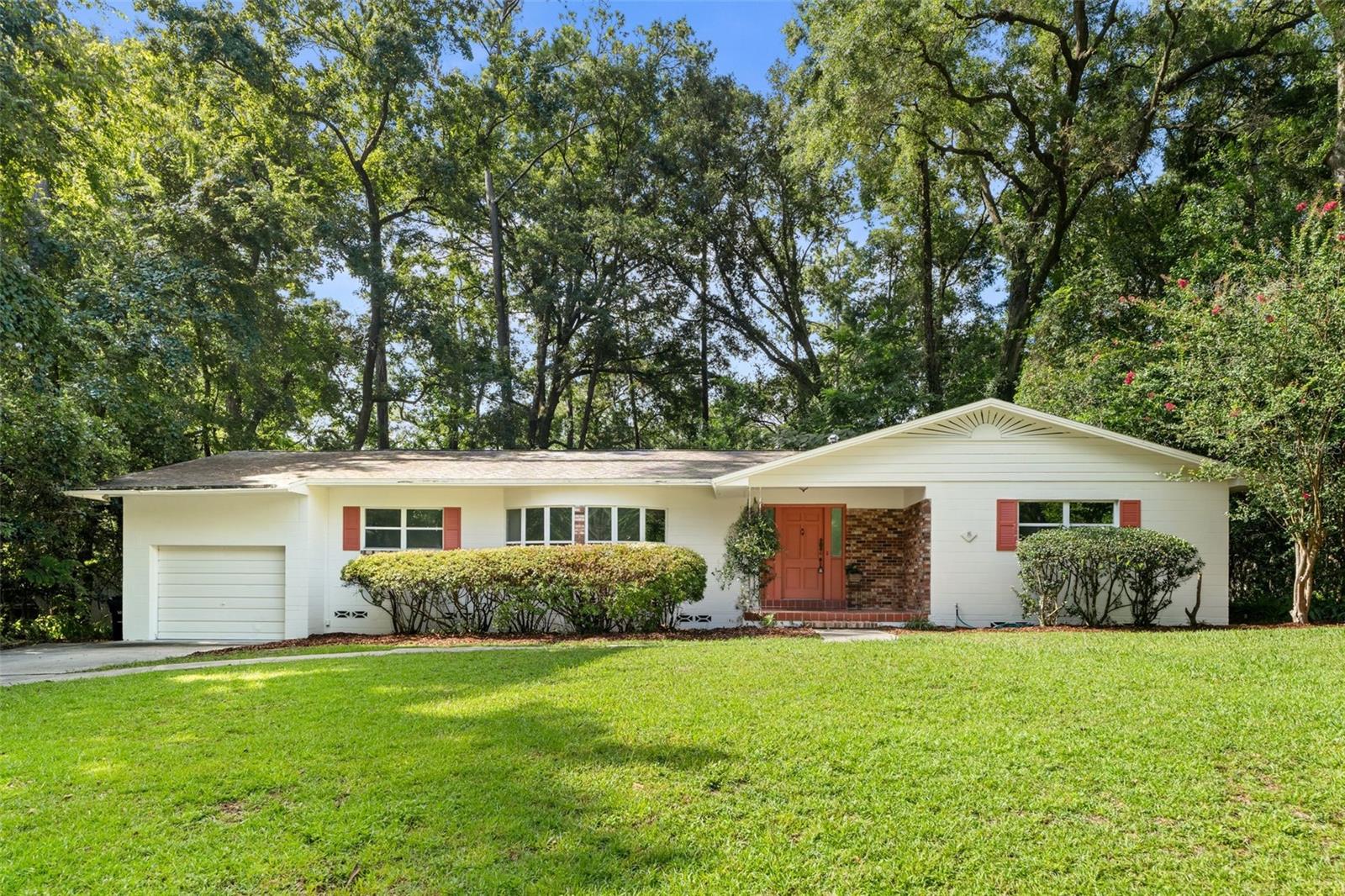 This Mid Century Modern home has kept all the charm and character of a vintage home with beautiful wood floors, spacious rooms and bay windows in the living room and breakfast area. Nice deck from French doors off back overlooking private backyard. Located in the heart Gainesville across the street from Albert Massey Park and the Loblolly Trails Next Door to newly renovated Littlewood Elementary, & Westwood Middle School. Its just a short stroll to the 300 Club. All new interior and exterior paint.